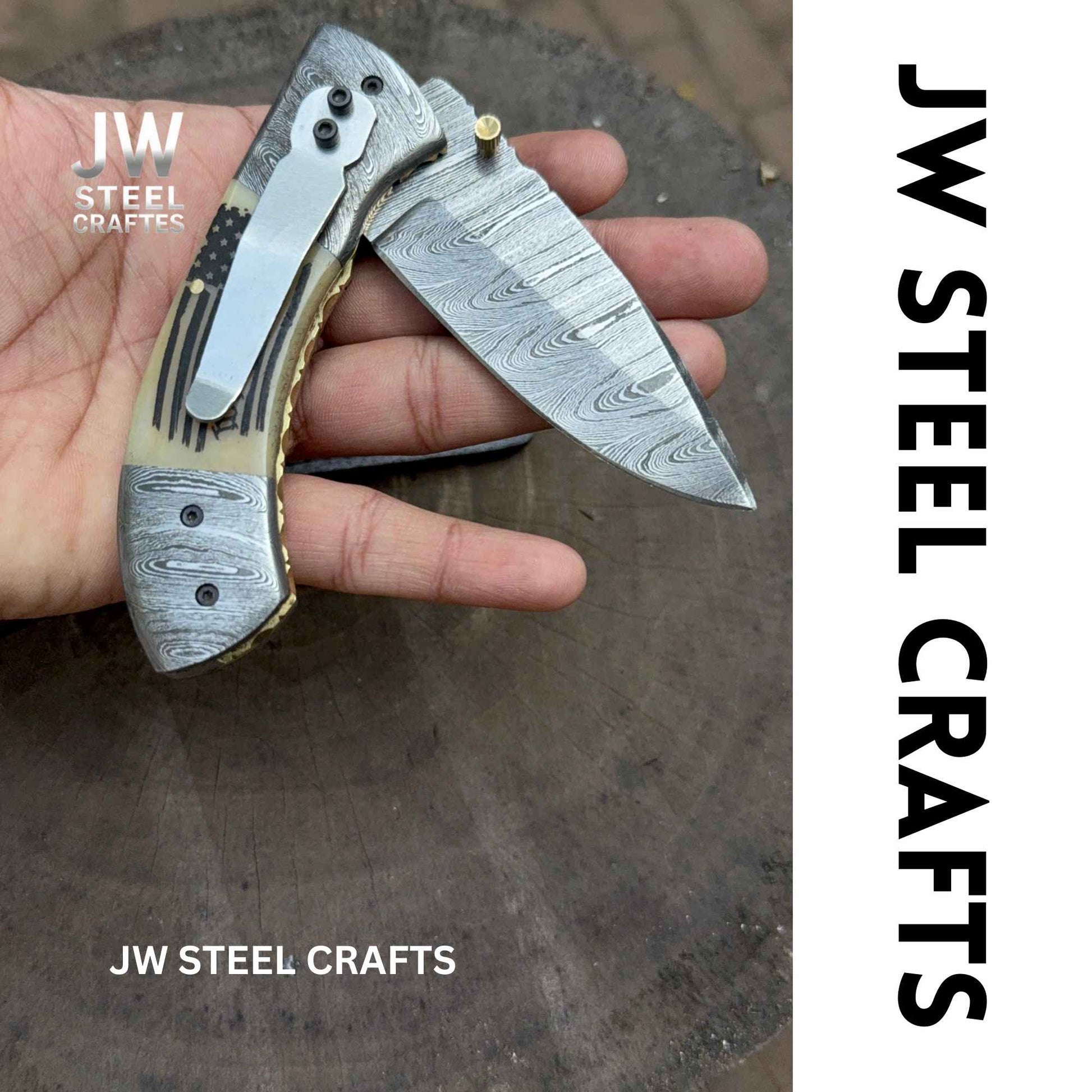 Folding knife held in a hand with 'JW Steel Crafts' branding.