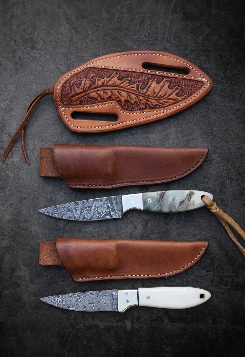 Handmade Damascus steel Buckaroo knives with marble bone handles and carved floral leather sheaths – JW Steel Crafts Western Buckaroo knife collection