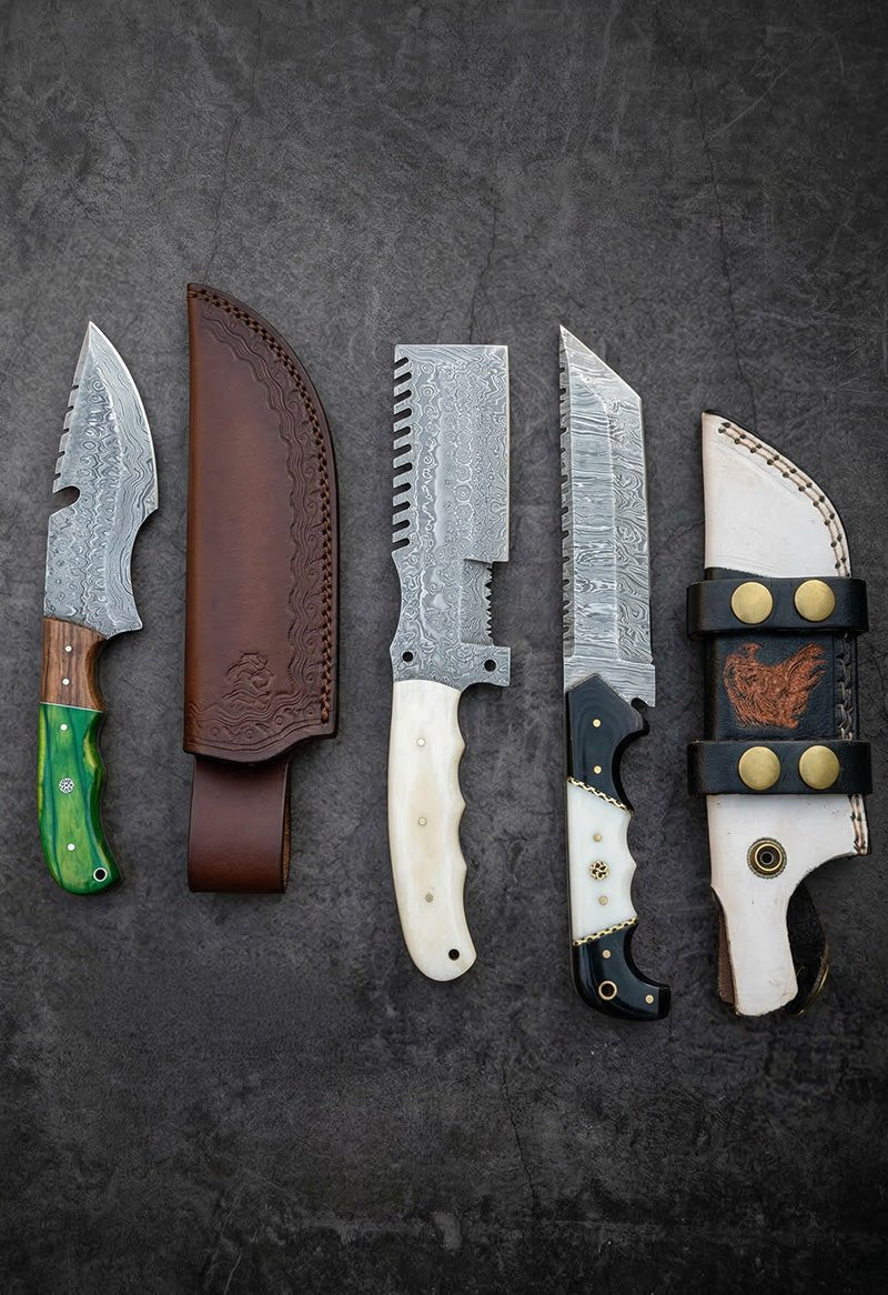 Set of handmade Damascus steel tracker knives with serrated spine, green and bone handles and leather sheaths – JW Steel Crafts custom tracker knife collection