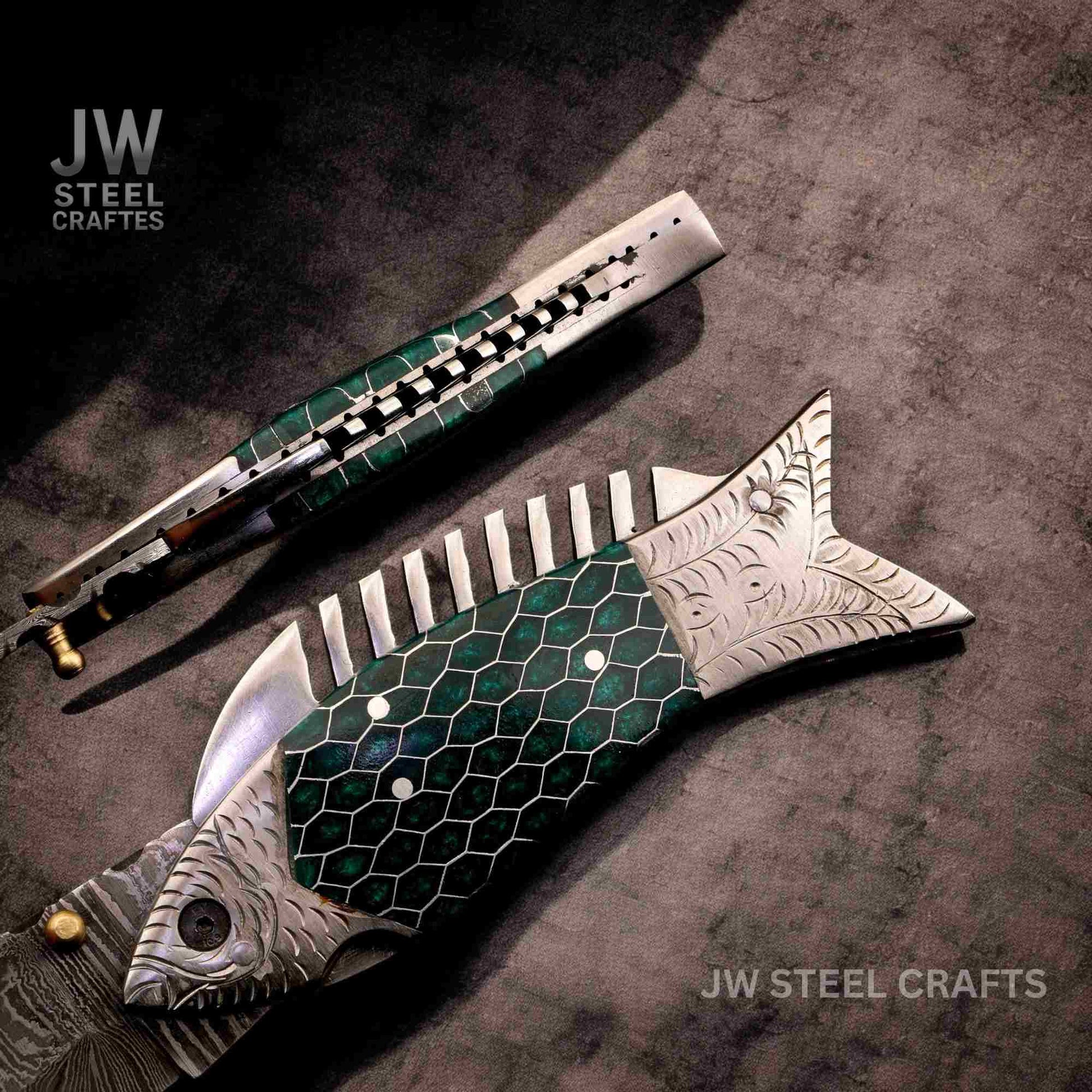 Decorative knife with green and silver design on a dark surface, branded 'JW Steel Crafts'.