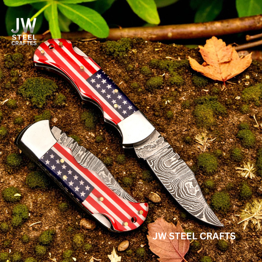 Two folding knives with American flag design on a natural background with 'JW Steel Crafts' branding.