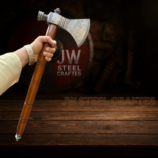 Hand holding a wooden axe with 'JW Steel Craftes' branding on a dark background