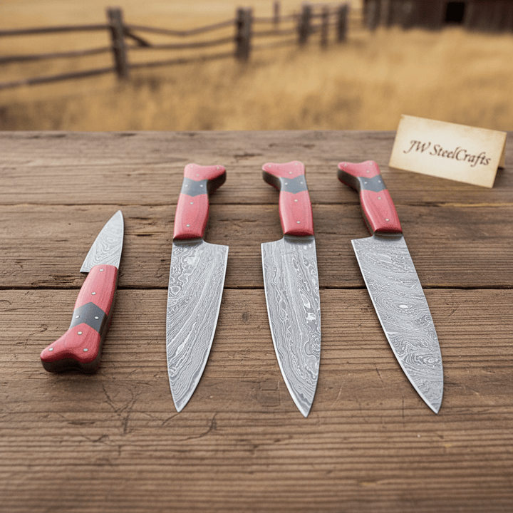 Chef knives made from Damascus steel with red ergonomic handle styling.