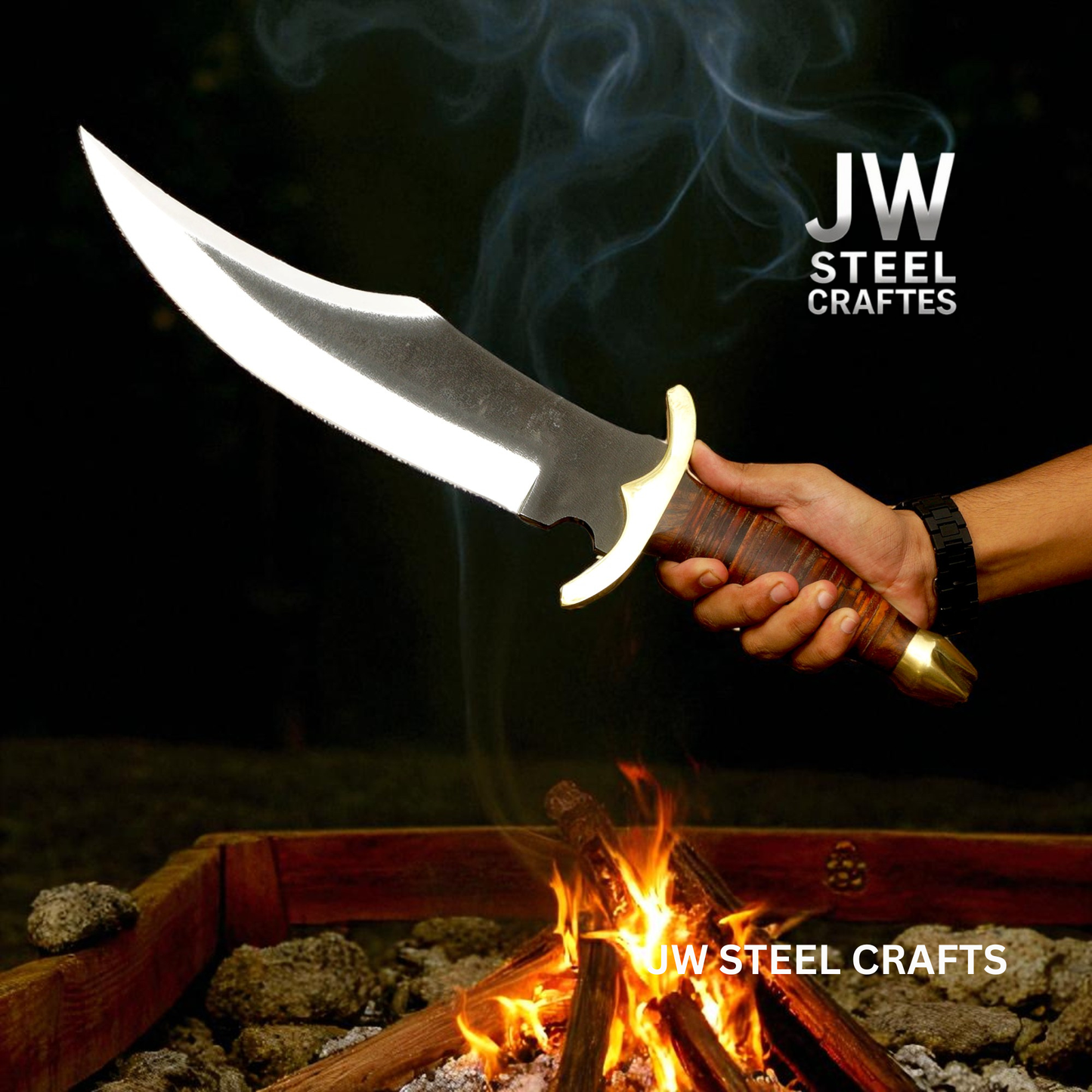 Hand holding a large knife over a campfire with 'JW Steel Crafts' branding.