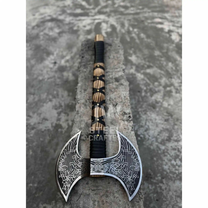 Hand engraved double headed Viking axe displayed on a roof