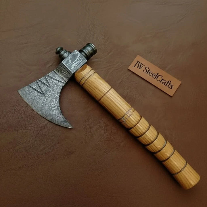     Driftwood handcrafted Viking axe set featuring etched Damascus blades and polished ash wood handles.