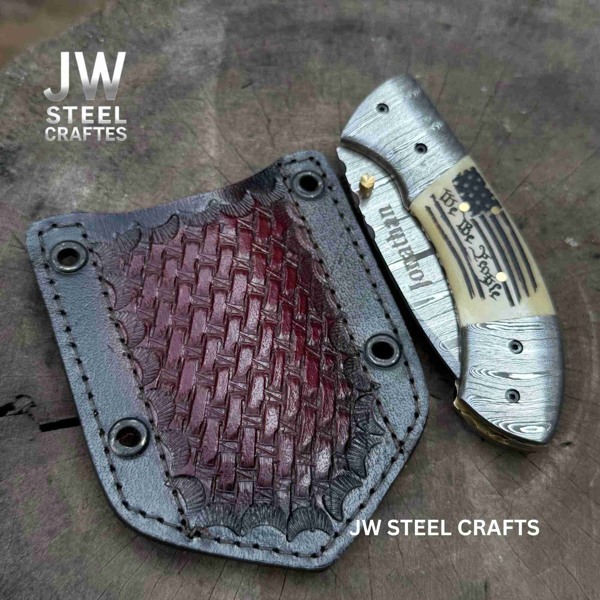 Knife with leather sheath on a textured surface, branded 'JW Steel Crafts'.