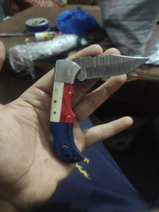 Pattern welded damascus steel folding knife with American flag handle