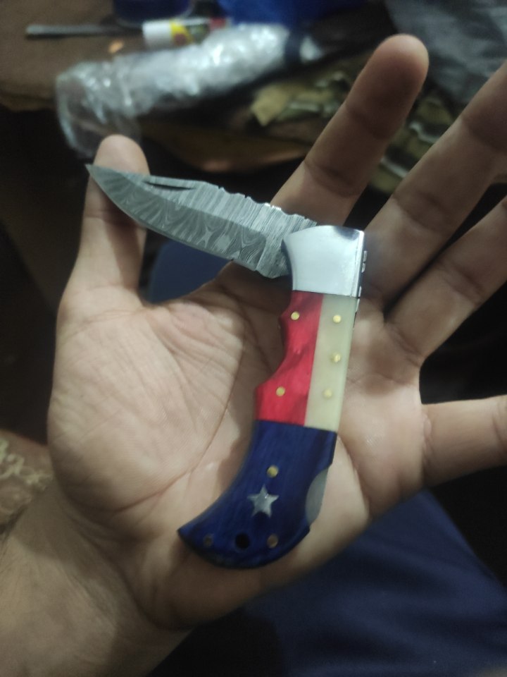 Pattern welded damascus steel folding knife with American flag handle