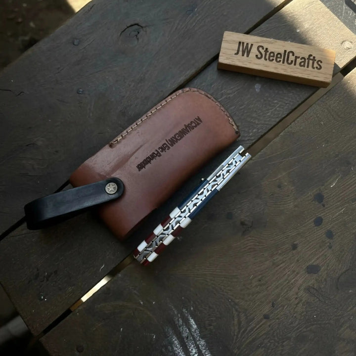 Damascus Folding Pocket Knife — American Flag Handle, Damascus Bolster, Linear Lock &amp; Hand Engraved Leather Sheath