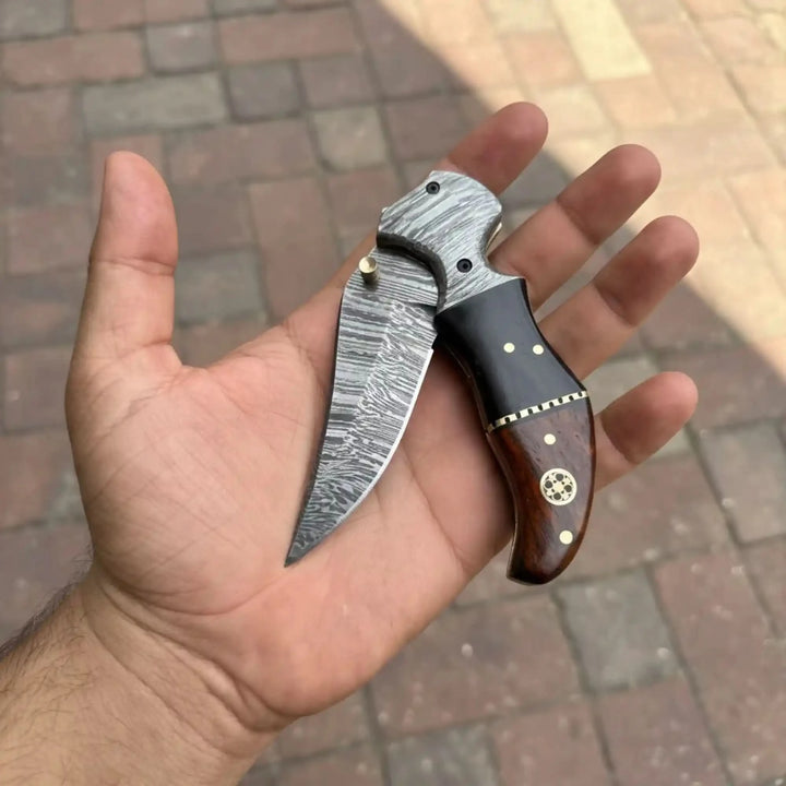 2-Piece Damascus Hawkbill Folding Pocket Knives — Liner Lock, Rosewood Black &amp; Cream Resin Handles, Brass Bolsters