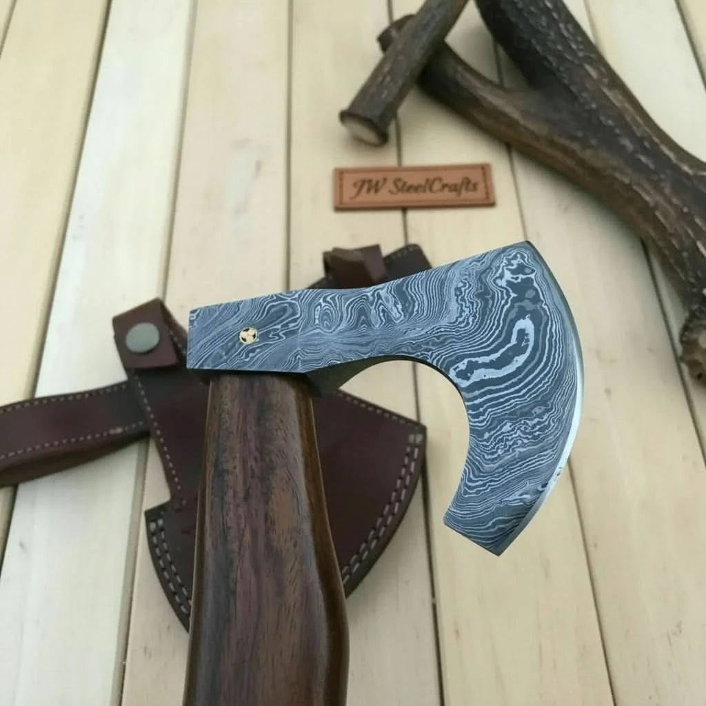     Ivorypine premium forged Viking axe with smooth curved hardwood handle and Damascus steel blade displayed outdoors.
