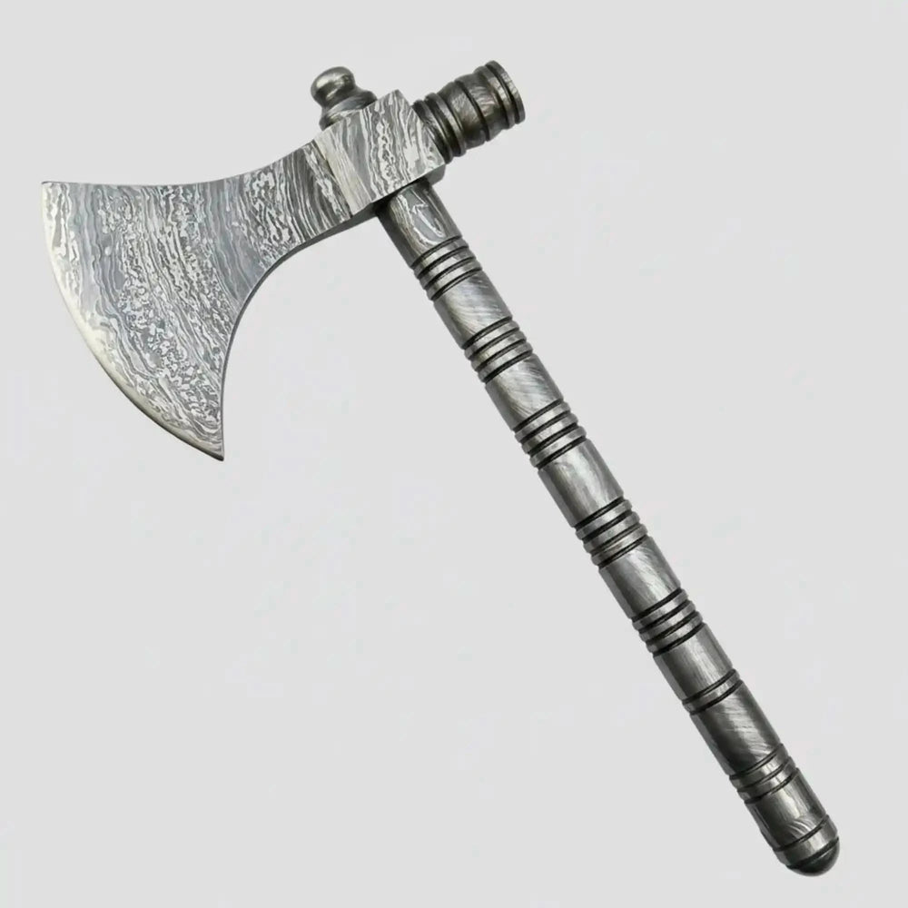     Luxury Damascus forged wilderness hand axe with artistic layered steel blade, textured grip handle, and premium handmade construction displayed among forest rocks and timber