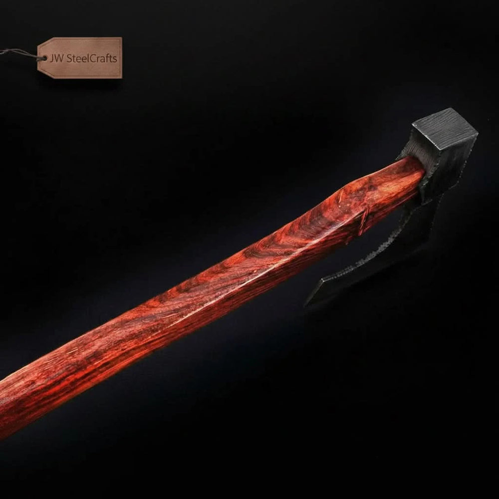     Forged woodland hatchet crafted with artisan Damascus steel blade and elegant wooden grip resting naturally among rugged stones and forest timber
