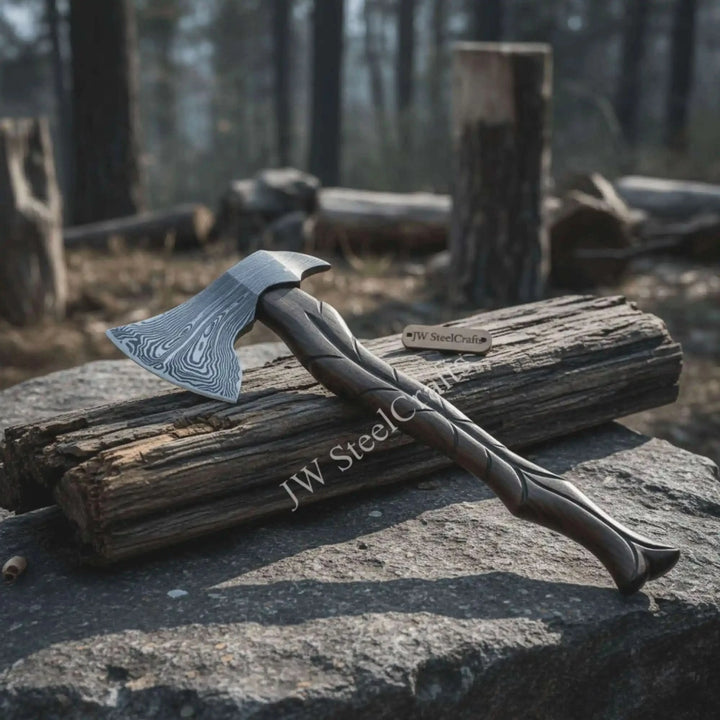     Viking-style axe with twisted black handle and Damascus steel blade displayed on rustic outdoor stone.