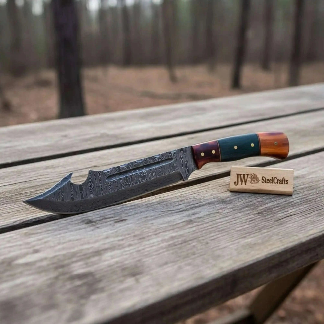     Modern Damascus recurve blade featuring detailed steel etching and handcrafted wooden grip