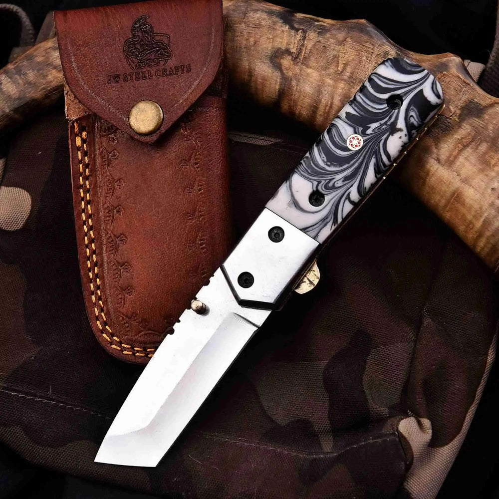     Precision EDC tanto blade pocket knife featuring black white swirl handle and sharp edge