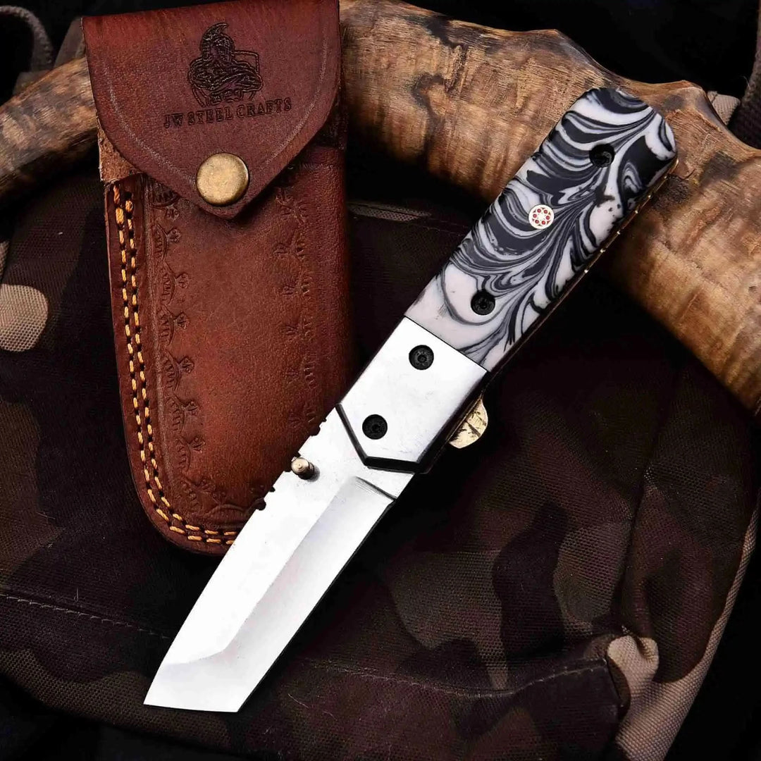     Precision EDC tanto blade pocket knife featuring black white swirl handle and sharp edge