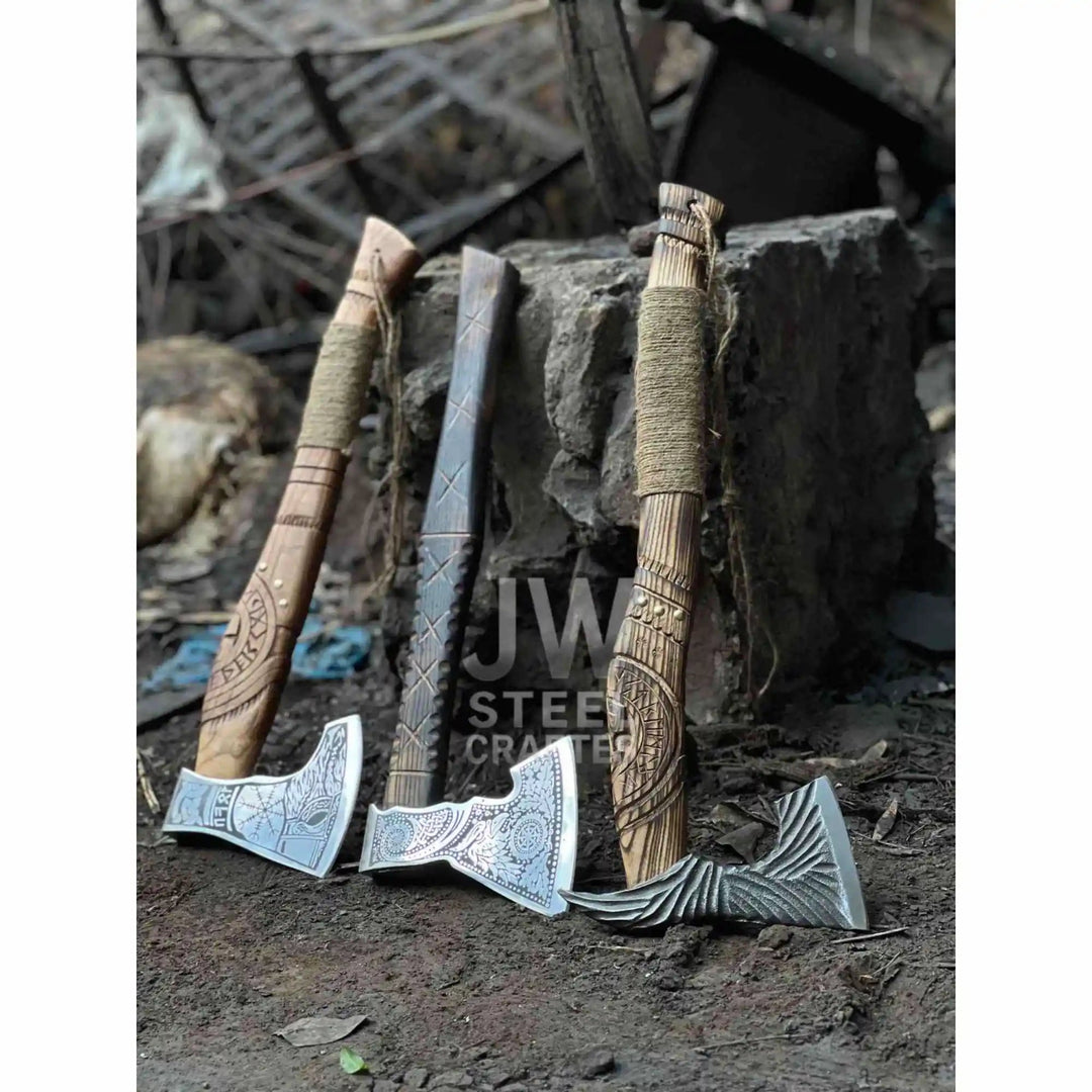 Bronze-inspired Norse battle axe set featuring decorative engravings and wrapped wooden grips beside a tree stump.