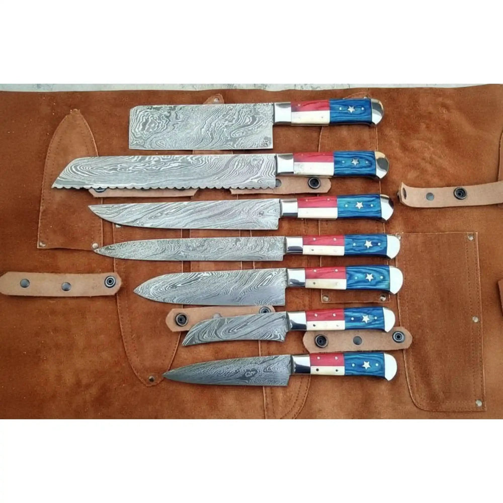 Patriotic chef cutlery set featuring red, white, and blue resin handles with star accents and polished layered steel blades.