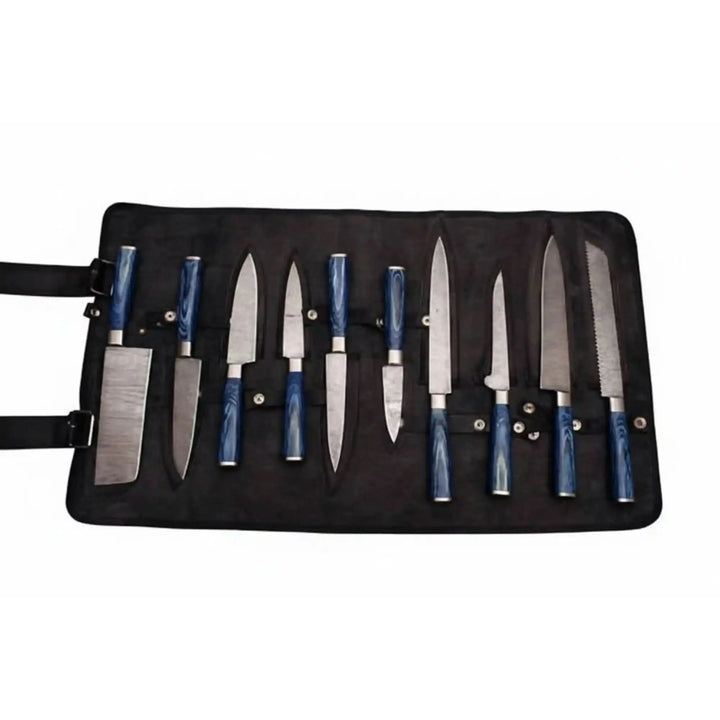 Damascus steel kitchen knife set with blue resin handles displayed inside black chef knife storage roll on white background.