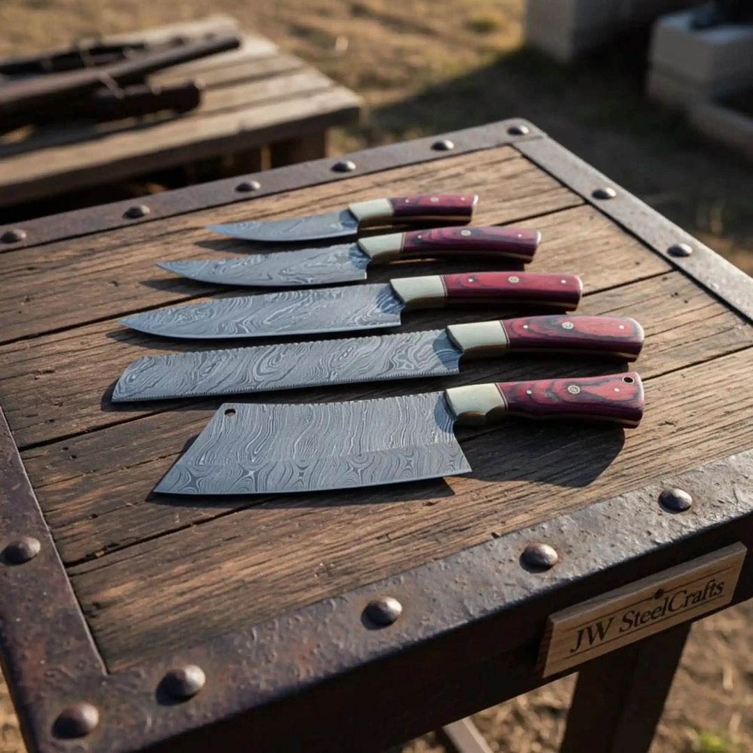 kitchen cutlery set featuring large cleaver blade alongside slicing and utility knives in refined presentation.