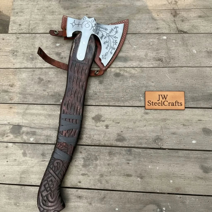Bronze-themed Nordic combat hatchet with engraved rune artwork and polished wooden craftsmanship.