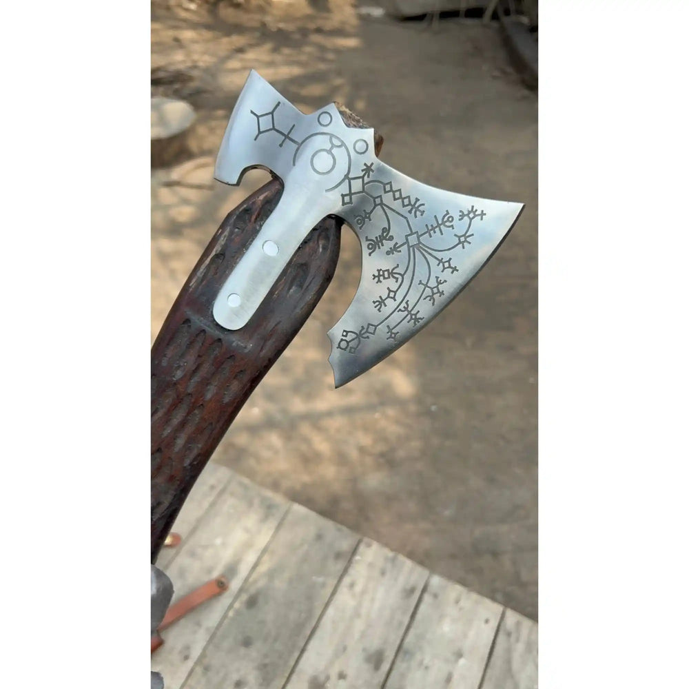 Carbon steel Viking double-bit axe side profile showing Norse rune etching on both sides of the hand forged steel head