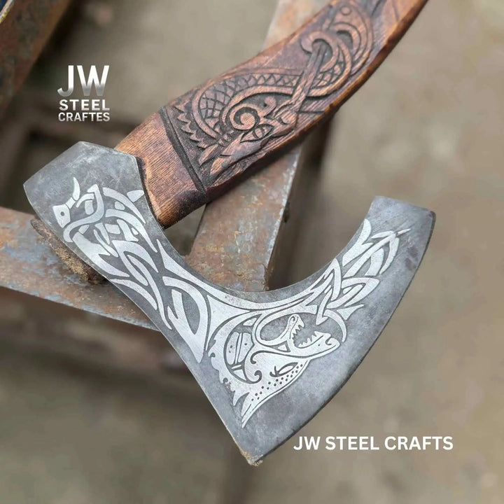 Embercliff-inspired Viking raven axe featuring polished steel engravings and handcrafted carved wooden handle.