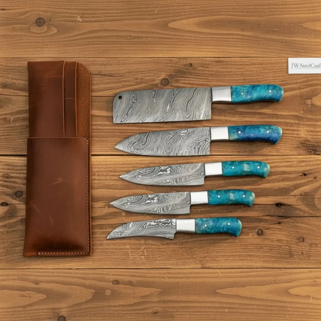 Handcrafted Damascus chef knife display with layered steel patterns and glossy blue ergonomic handles.
