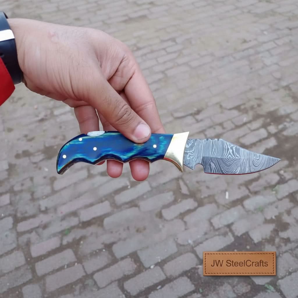     Granitepeak Damascus pocket knife with blue scales and sharp utility blade for outdoor and daily carry