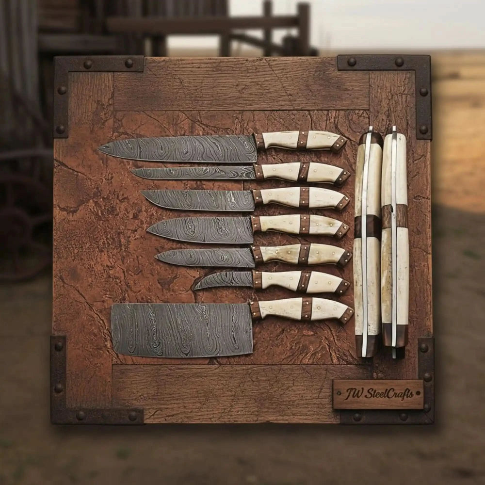 Damascus chef knife set featuring polished metallic finishes, dark spacer accents, and ivory colored ergonomic handles.
