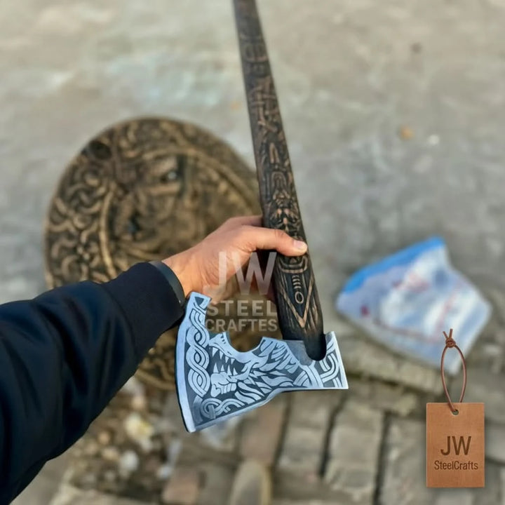 Hand-engraved axe with Norse blade and handle detailing matching the JW SteelCrafts Viking shield set design
