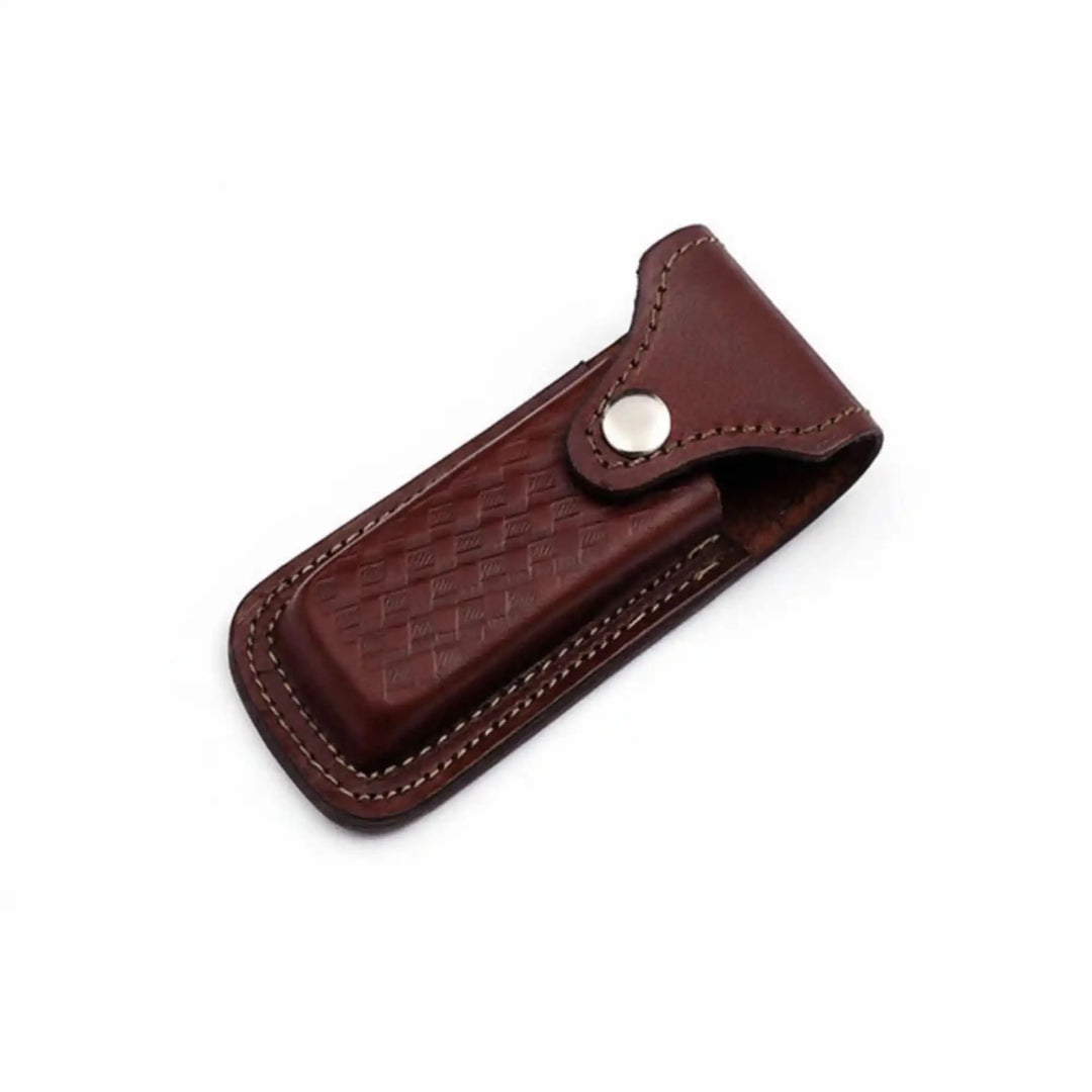     Genuine leather pocket knife pouch with metal button closure and compact handcrafted profile