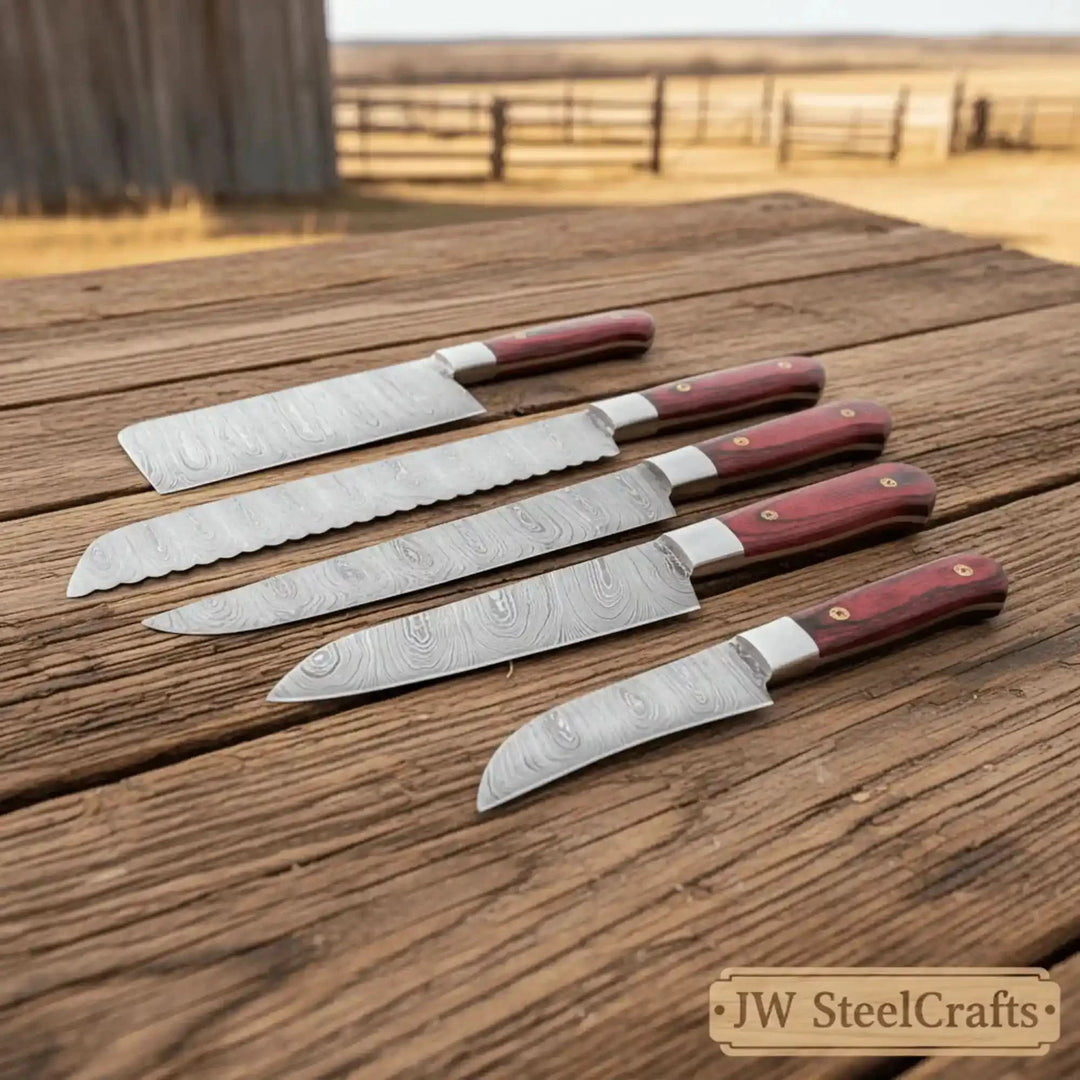 Serrated and chef knife set with matching burgundy handles and layered steel blades.