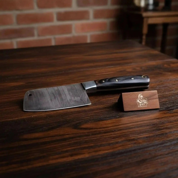 Signature cleaver knife with blue handle, patterned blade, and JW SteelCrafts tag
