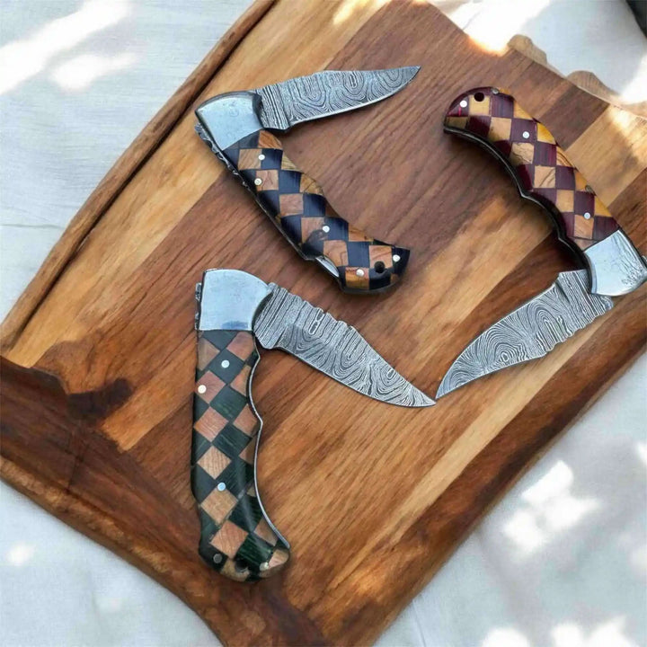     Stoneedge checkered wood handle knives with layered Damascus finish and refined everyday carry blade styling