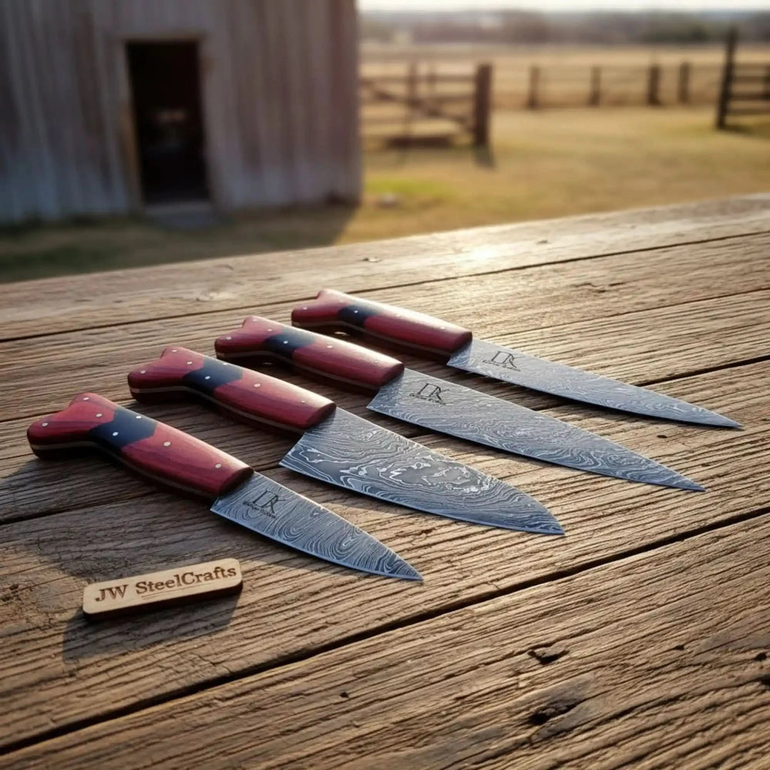 Red wood Damascus knives with sharp steel blades and smooth ergonomic grips.