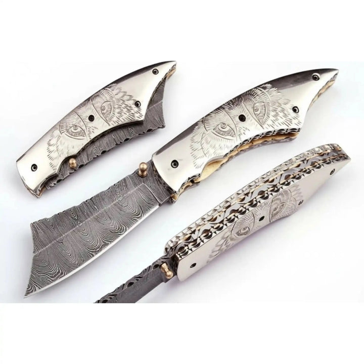     Mistforge Damascus pocket blade with detailed handle artwork and premium handcrafted steel cutting edge quality