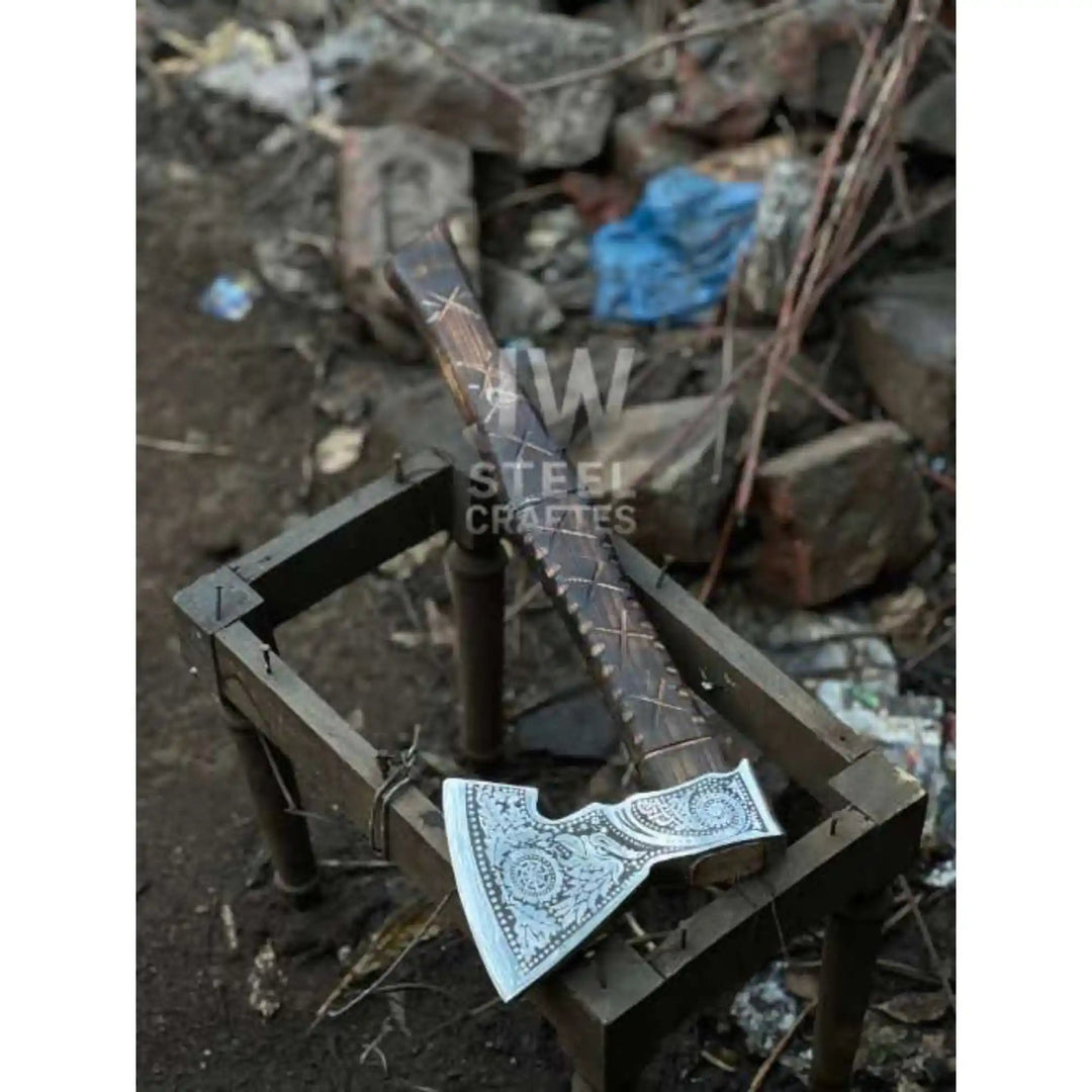 
Norse engraved axe head showing distinct rune and knotwork patterns side by side

