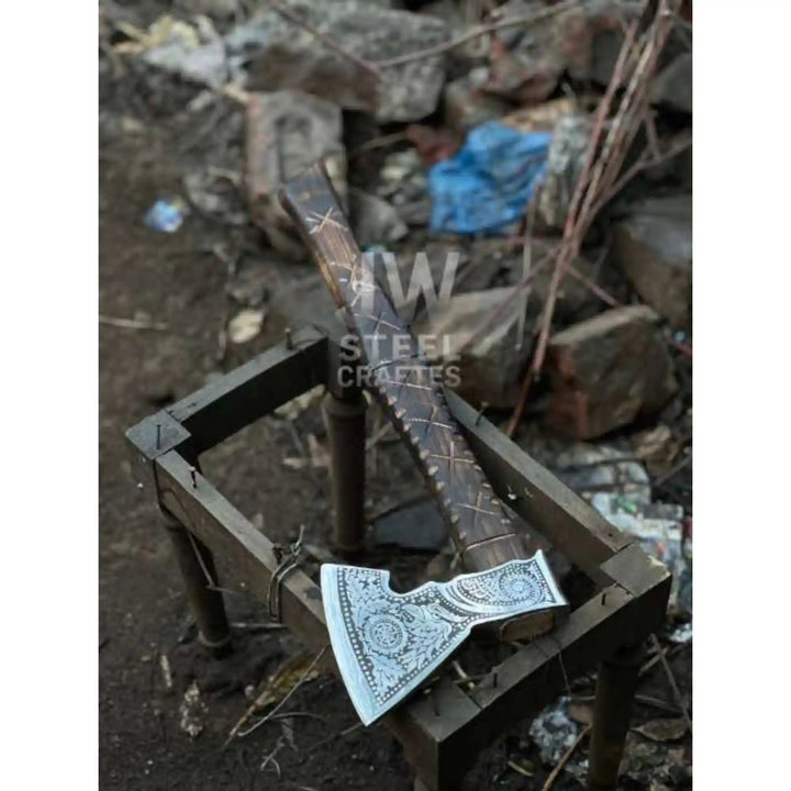 
Norse engraved axe head showing distinct rune and knotwork patterns side by side

