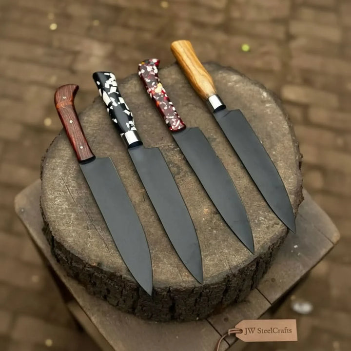 Four piece kitchen knife set placed on a round stump with rustic outdoor background