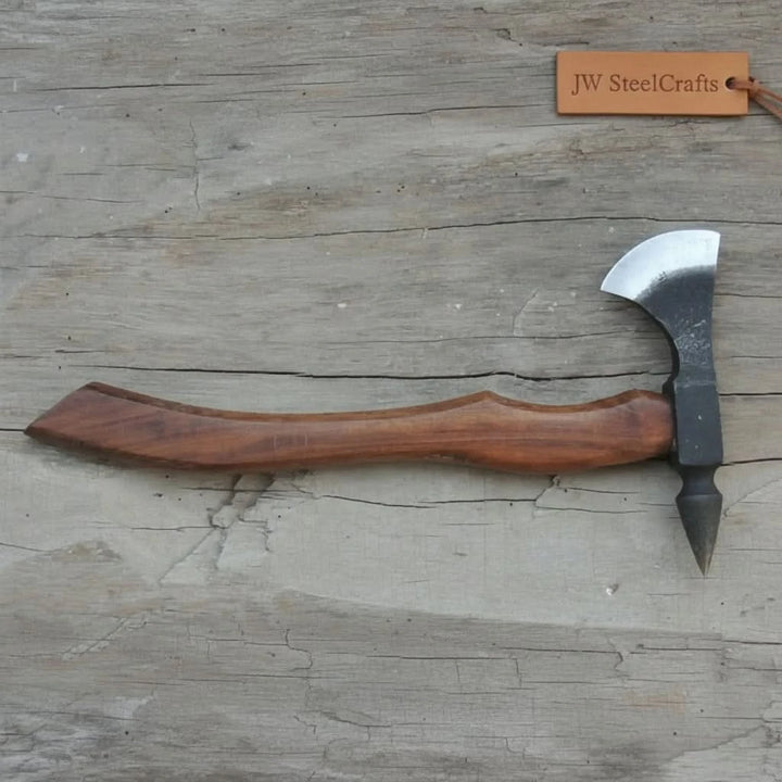     Premium steel bushcraft hatchet designed with a rear pick spike and ergonomic wooden handle for outdoor use.