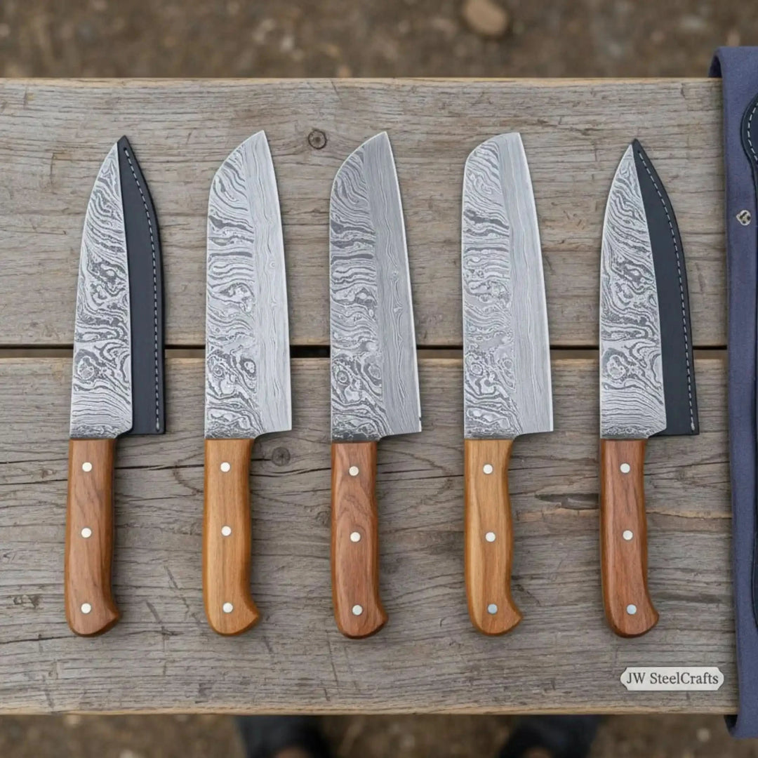 Kitchen knife set with decorative Damascus steel blades and smooth natural wood handles.