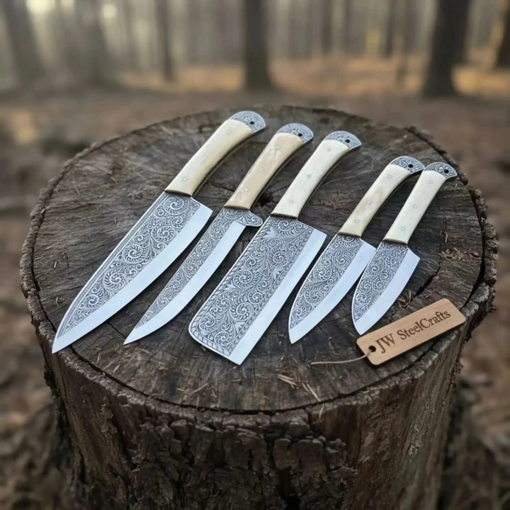 Custom Damascus Chef Set Of Knives With Decorative Blades Displayed On A Wooden Stump.