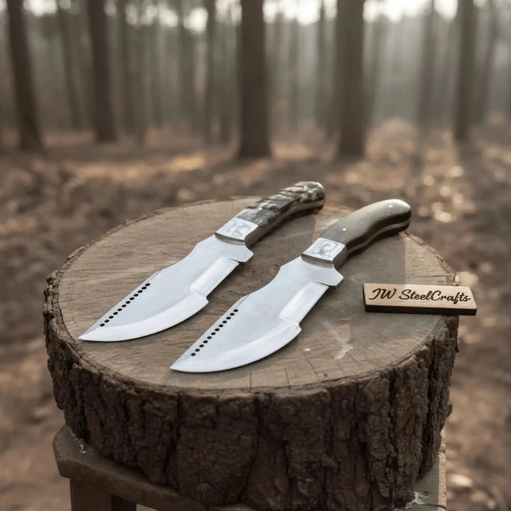 Steel cleaver style knife with brown wood grip, white handle pins, polished blade, and black decorative blade holes.