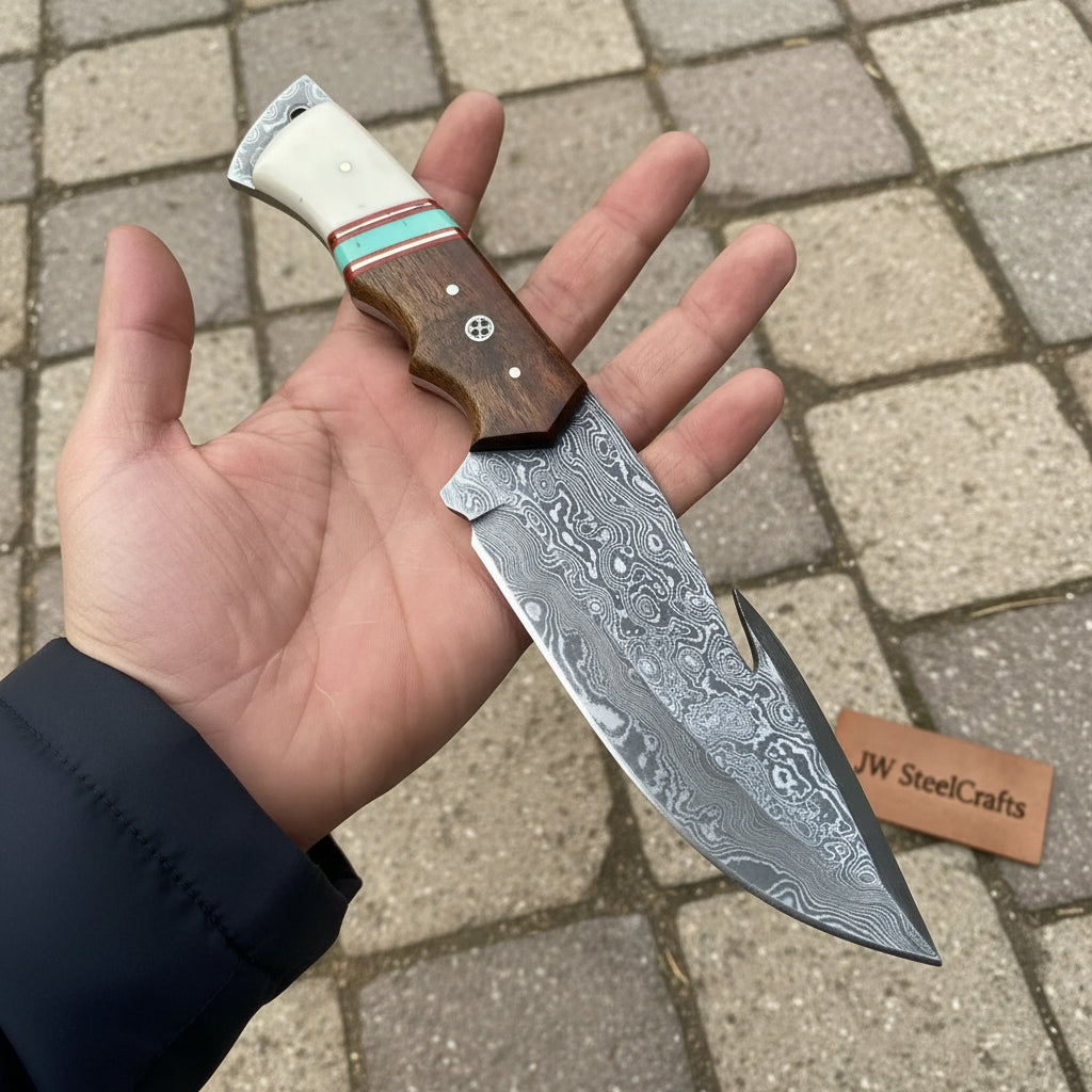 Wood and bone handle Damascus gut hook knife with mosaic pin, white rivets, and sharp patterned steel blade