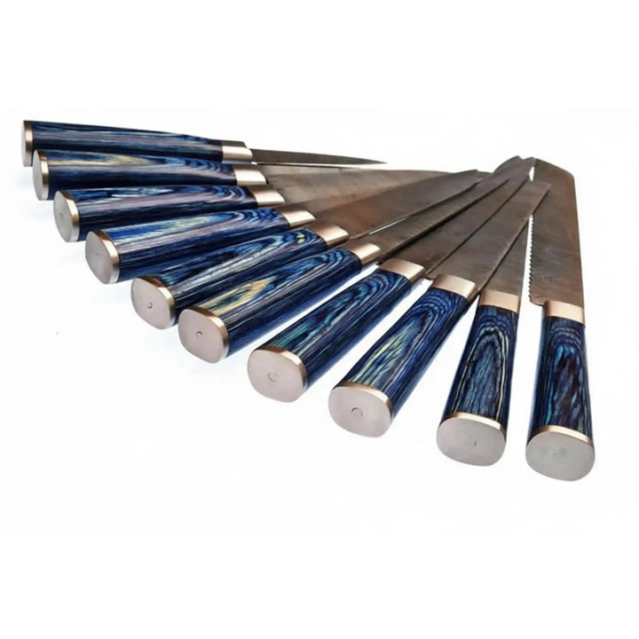 Professional cooking knives photographed in artistic fan arrangement showcasing sleek blade profiles and precision craftsmanship.