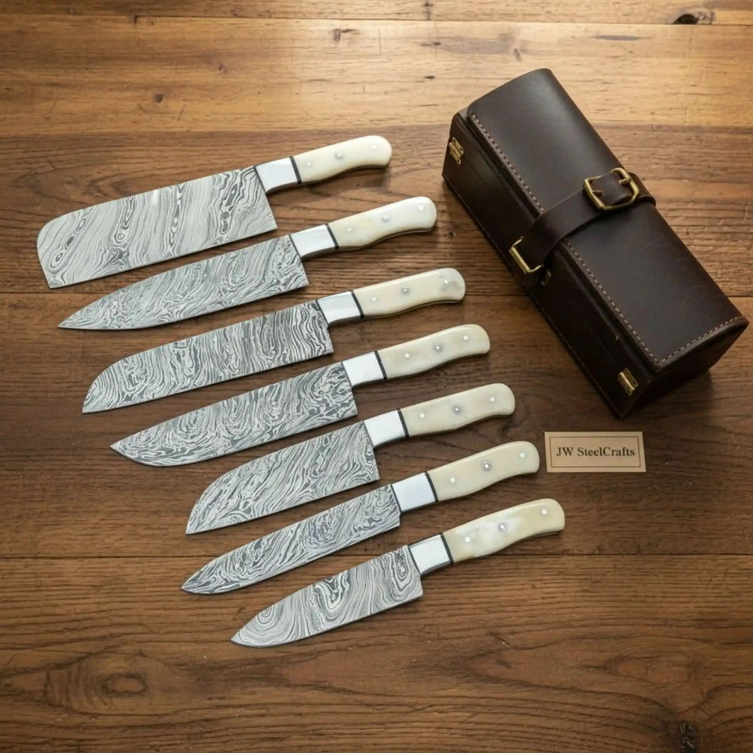 Mastercraft Damascus chef cutlery with decorative blade detailing and polished cream ergonomic handles.