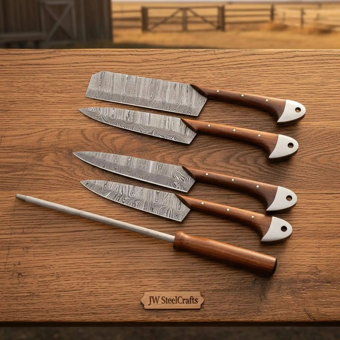Kitchen knives with Damascus pattern blades and handcrafted ergonomic wooden handles.